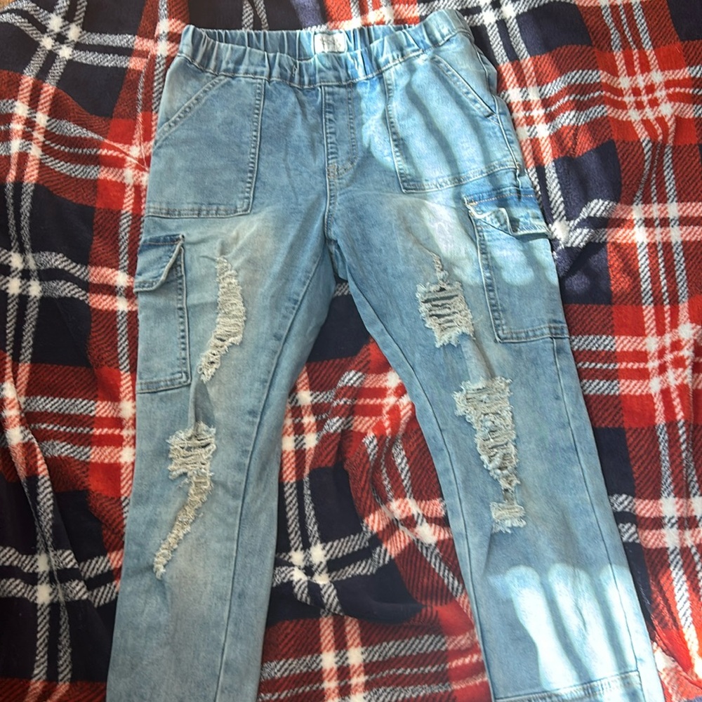 Washed off ripped jeans in a size 7 barely worn in very good condition